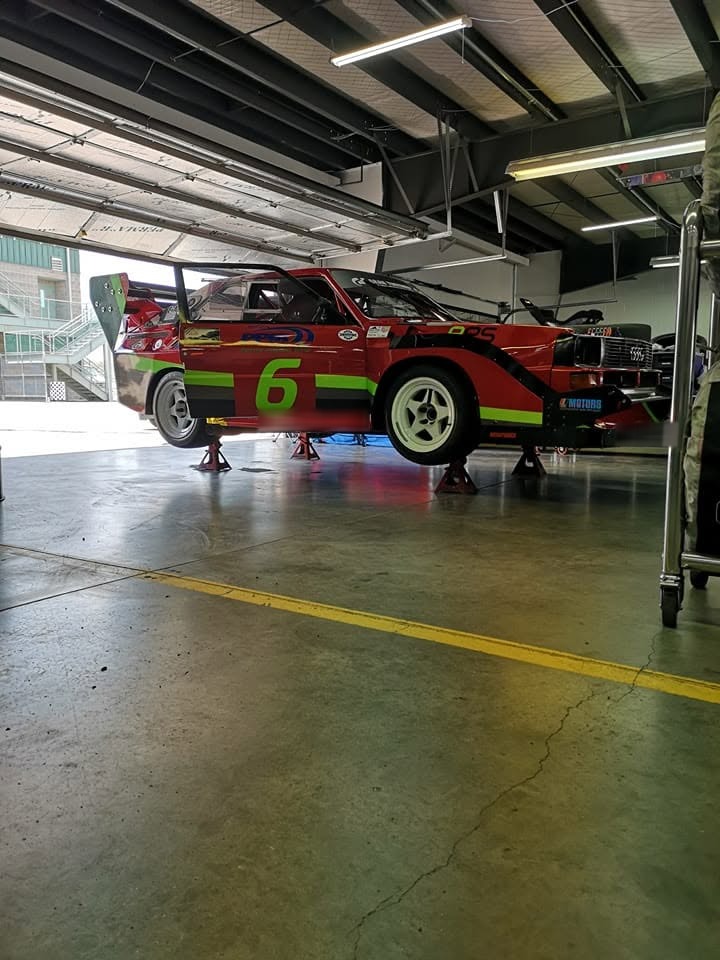 The number 6 Quattro on stands in a pit garage