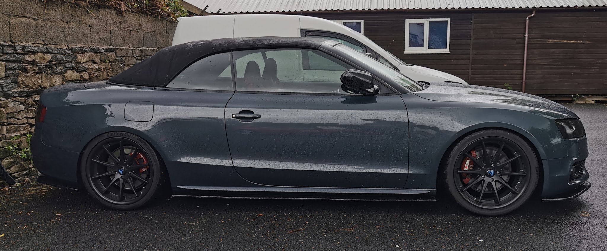 Grey Audi A5 cabriolet on black alloy wheels, side view